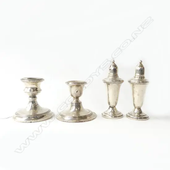 FOUR STG SILVER ITEMS – TWO CANDLEHOLDERS BIRMINGHAM 1911 & 1913, AND LARGE STG SALT AND PEPPER SHAKERS, (SOME DENTS), H
