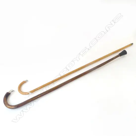 TWO ANTIQUE STG SILVER TIPPED WALKING STICKS LONDON 1911 AND LONDON 1912. L.900MM L.940MM