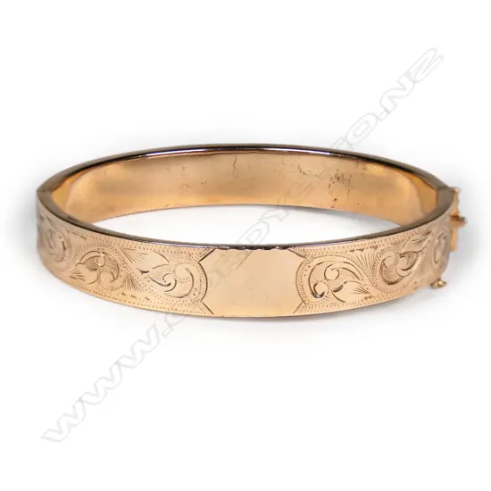A 9ct rose gold hinged bangle,