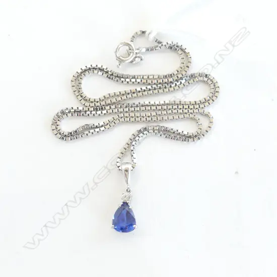 18ct WHITE GOLD PENDANT NECKLACE the pendant with pear cut SAPPHIRE of good colour below a single diamond 6.6gms