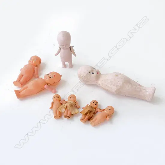 COLLECTION OF 8 SMALL KEWPIE DOLLS INCLUDING ONE BISQUE JOINTED