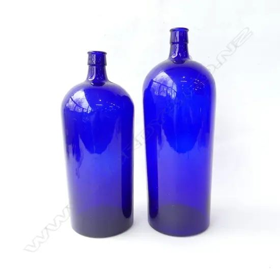 TWO LARGE BLUE POISON GLASS BOTTLES EMBOSSED 100 & 120 TO BASE, H. 320MM-360MM