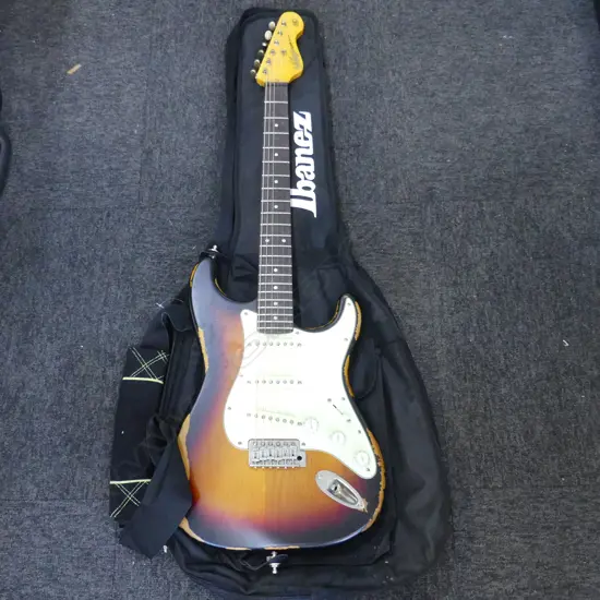 VINTAGE BRAND ICON SERIES V6 STRATOCASTER WITH SOFT CASE SHOWING WEAR