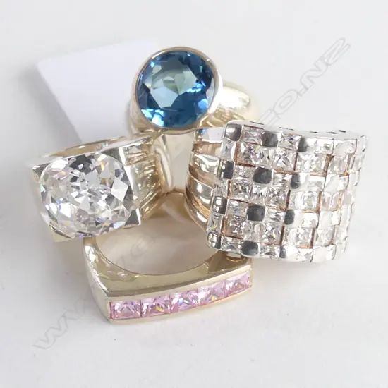 4 SILVER COSTUME RINGS, new old stock, various sizes