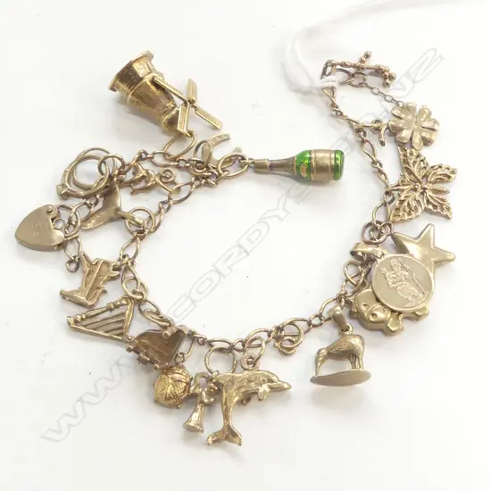 9ct YELLOW GOLD CHARM BRACELET piano + dolphin + harp etc 23.3gms