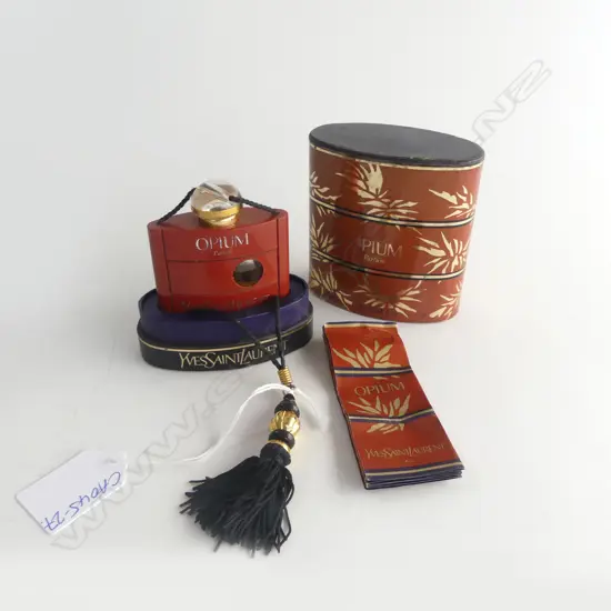 CASED OPIUM PERFUME BOTTLE w some perfume 