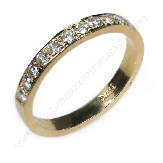 An 18ct yellow gold and multi diamond set band ring,
