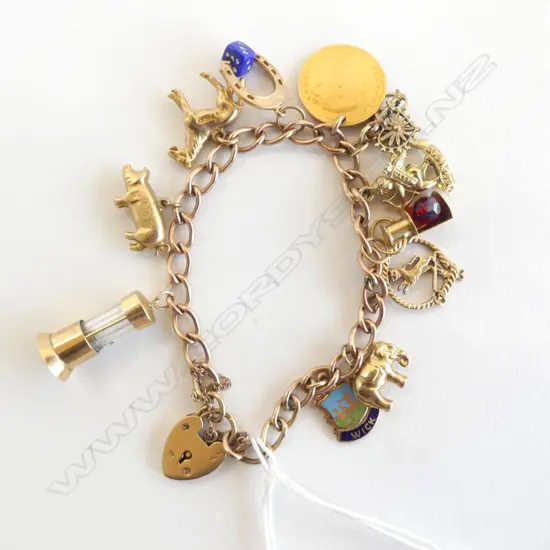 9ct gold CHARM BRACELET 10 charms incls. 1881 half sovereign 29gms