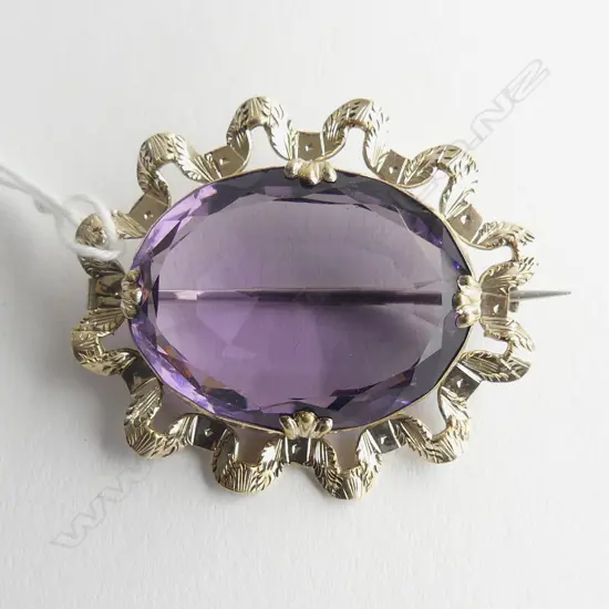 ROLLED GOLD AND PASTE AMETHYST BROOCH