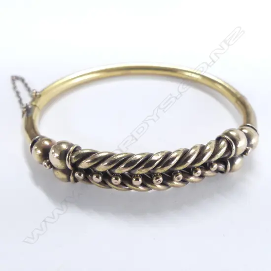 14ct GOLD TWIST HINGED BANGLE WITH SAFETY CHAIN 14gms