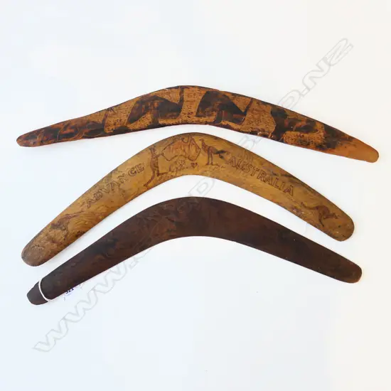 THREE WOODEN ENGRAVED BOOMERANGS, LONGEST 530MM 
