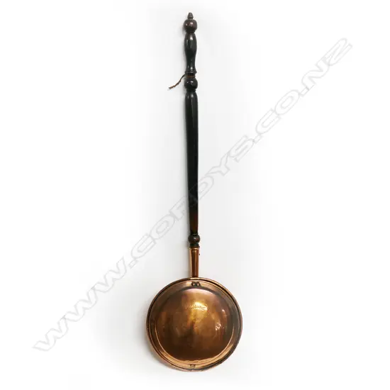19thC copper bed warming pan engraved and with turned wooden handle: Ex. The collection of Valerie and John Robertson.