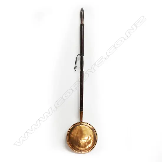19thC copper bed warming pan engraved and with turned wooden handle: Ex. The collection of Valerie and John Robertson.
