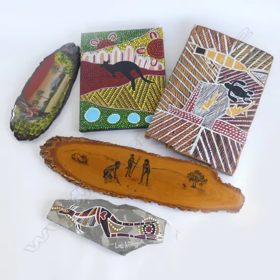 FIVE  ABORIGINAL ART DECORATIONS, 3  WOOD, 1 CANVAS AND ONE STONE, LONGEST 450MM