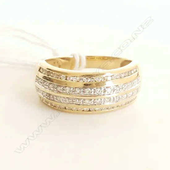 9CT YELLOW GOLD DIAMOND CHANNEL SET RING 3.79gms