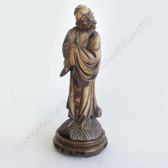 CARVED WOODEN ORIENTAL FIGURE ON STAND H.270mm