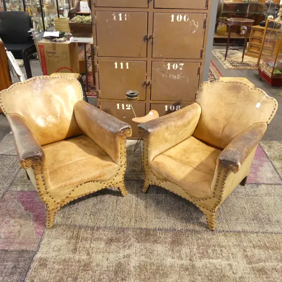 PR VINTAGE FRENCH LEATHER CHAIRS showing some wear. Studded detail.