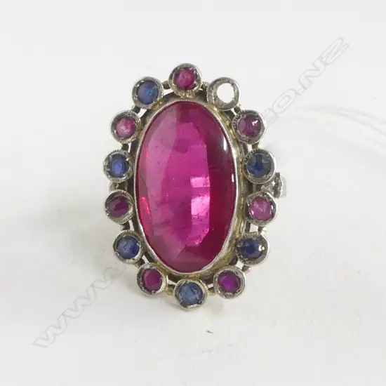 IMPRESSIVE 14 TO 18CT GOLD MULTI STONE RING synthetic center stone rubies & sapphires framing 1 missing 10.4gms