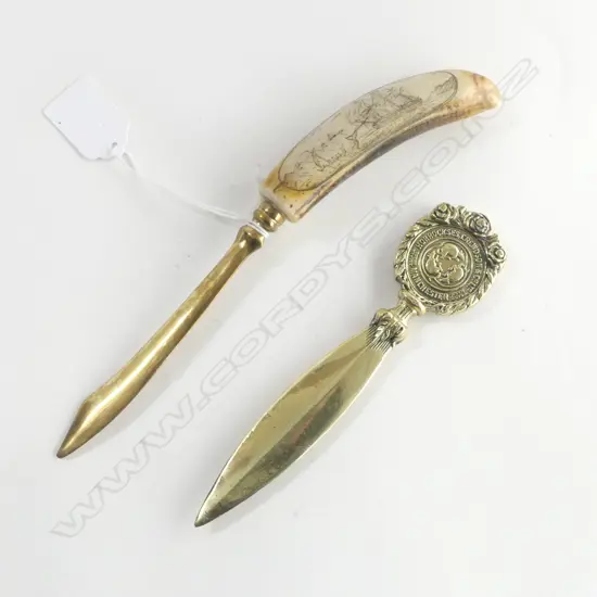 TWO BRASS LETTER OPENERS ONE WITH RESIN AND FAUX SCRIMSHAW