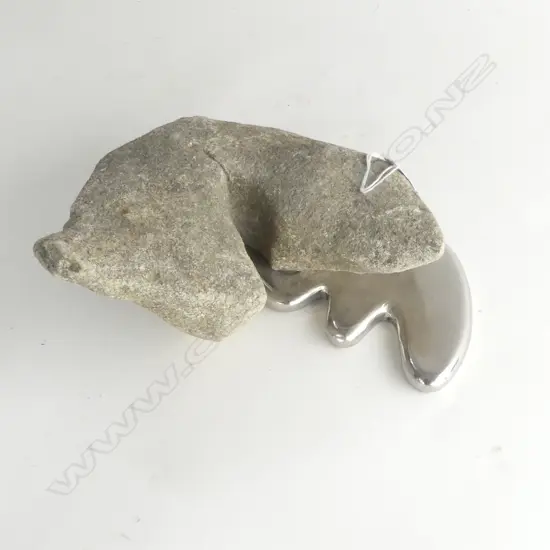 Dean Corbet (NZ) 'Overflow' sculpture.  Limestone & stainless steel. 400 x 150mm.  Provenance: From the Koula collection