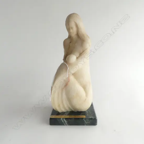 Graham Cooper (NZ) Seated Mother & Baby. Carved White Stone sculpture on green stone base. 280 x 130mm