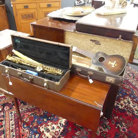 2 CASED INSTRUMENTS; UKELELE & WIND INSTRUMENT