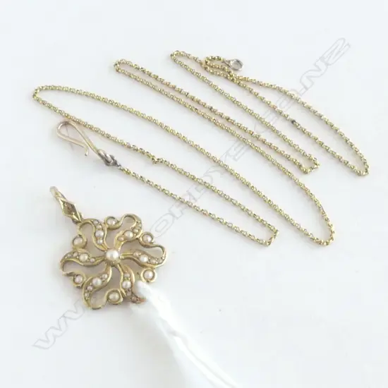 15CT GOLD SEED PEARL PENDANT ON UNMARKED GOLD CHAIN 4.8gms