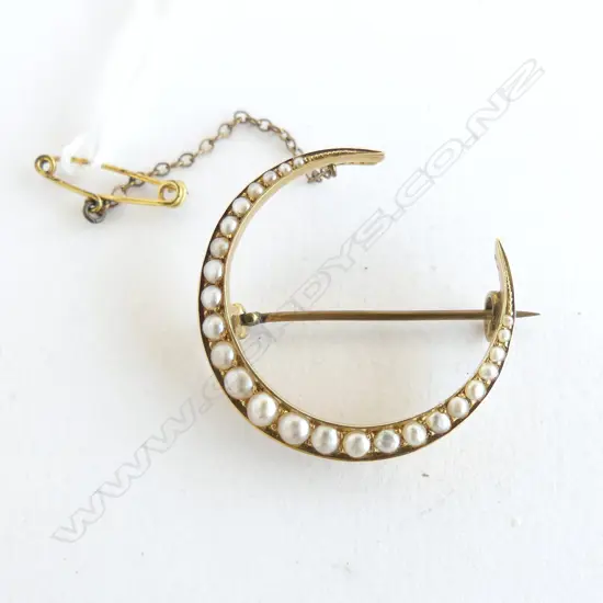 A Victorian 15ct. yellow gold crescent and seed pearl brooch 5.63gms