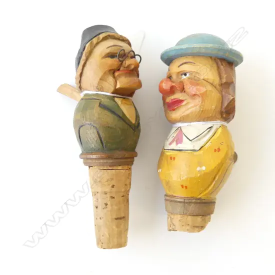 TWO CARVED BLACK FOREST GERMAN BOTTLESTOPS, ARTICULATED ONE AS MAN WITH FIGURE INSIDE HAT, OLD LADY MOVING JAW