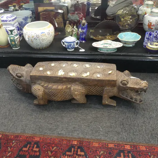 INDONESIAN CARVED WOODEN MANCALA / CONGKLAK GAME; DOUBLE HEADED CROCODILE FORM W.820mm