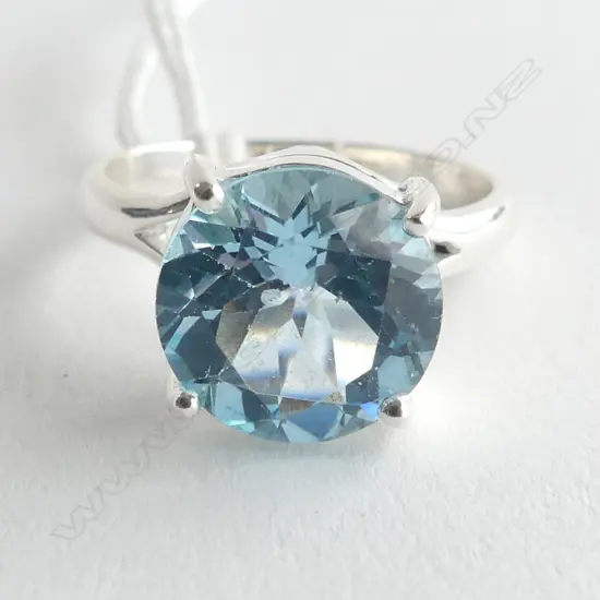 SILVER & BLUE TOPAZ RING, ROUND CUT IN RAISED SETTING SIZE U