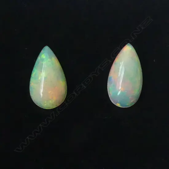 PAIR MATCHING UNSET WHITE OPALS 3.33ct, AIG CERT