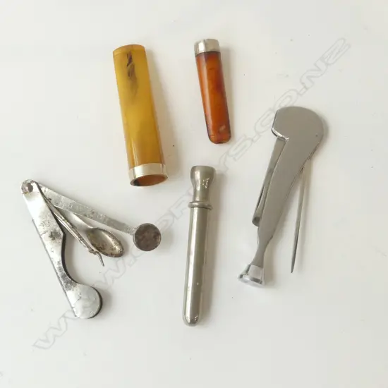 TWO AMBER CIGAR HOLDERS & 3 VINTAGE SMOKING PIPE TOOLS