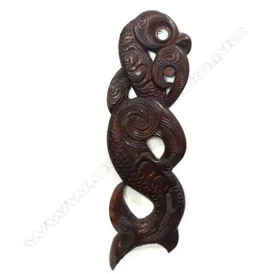 Note to back: ' This carving represents TAHI a friendly Taniwha (serpent), when danger would appear on the waters of the tribe the taniwha would appear also’ and Pakati - 4 distinct cuts of the chisel. A signature' of a carver from Whaika village.'