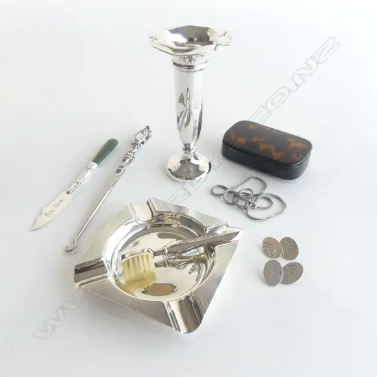 7 PCES STG SILVER; VASE, ASHTRAY, PR CUFFLINKS, MOUSTACHEBRUSH, KNIFE, BOOT HOOK, NECKLACE + TORTOISESHELL BOX W.80mm AF