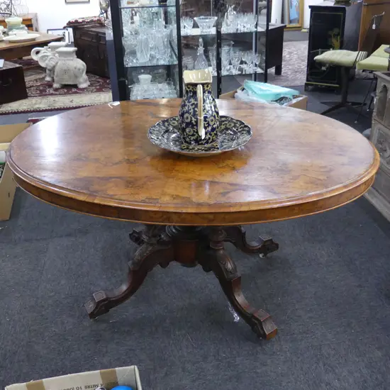 VICTORIAN FIGURED WALNUT OVAL LOO TABLE with cathedral carved & turned  base. 1420x1030x750mm