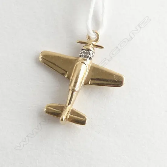 9ct yellow gold airplane (spitfire) SET WITH DIA. 1.6gms charm/pendant