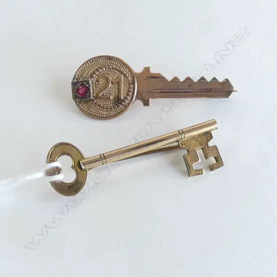 9CT 21st KEY BROOCH, 2.1gms + 15CT PLATED KEY BROOCH