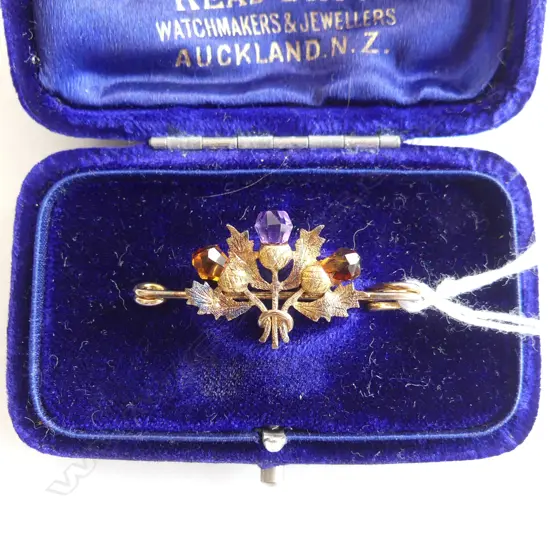 9ct YELLOW GOLD SCOTTISH THISTLE BROOCH amethyst & 2 citrine? set in box 2.14gms