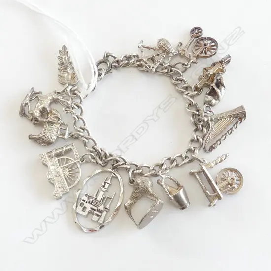 SILVER CHARM BRACELET charms include kiwi. London Bridge. Irish harp. Elephant etc 