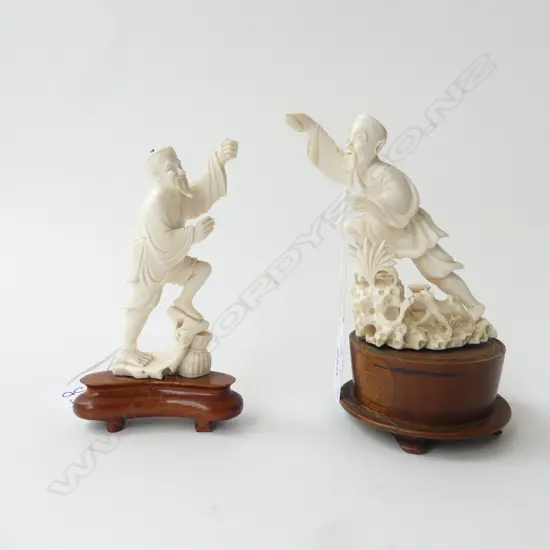 2 CHINESE IVORY FIGURINES ON WOODEN STANDS, (both missing spear, 1 missing cap) H.140mm & 130mm