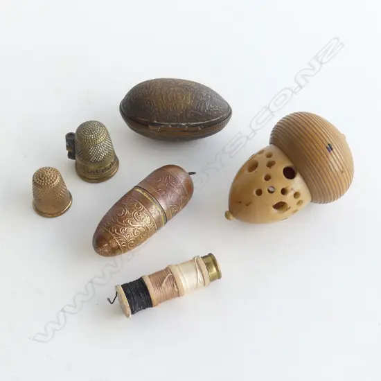 THREE THIMBLE HOLDERS, ONE AS NUT, AS BRASS EGG,AS BULLET SHAPE