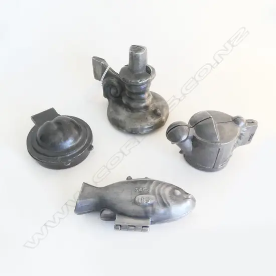 4 VINTAGE PEWTER ICE CREAM MOULDS; CANDLESTICK, WATERING CAN, PEACH TART & FISH