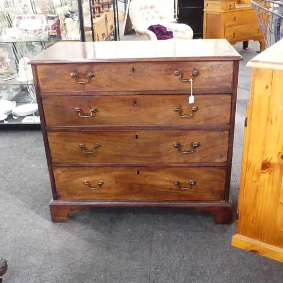 A Georgian mahogany four drawer chest,