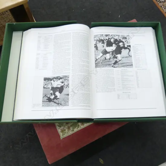 LG FORMAT CASED BOOK 'THE VISITORS: THE HISTORY OF INTERNATIONAL RUGBY TOURS IN NZ' 397/1200 MOA 1990 570x420mm