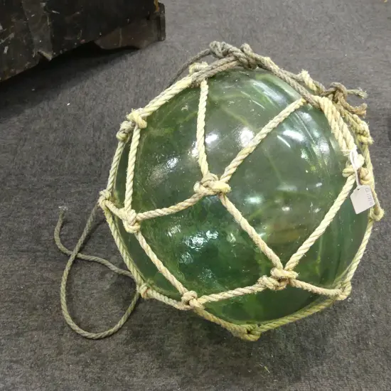 OLD GLASS FISHING FLOAT w. NETTING APPROX 370mm DIA.