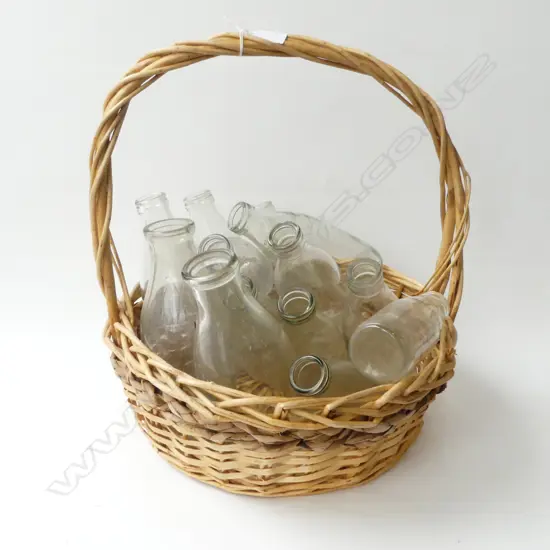 13 VINTAGE GLASS MILK BOTTLES VARIOUS SIZES IN CANE BASKET