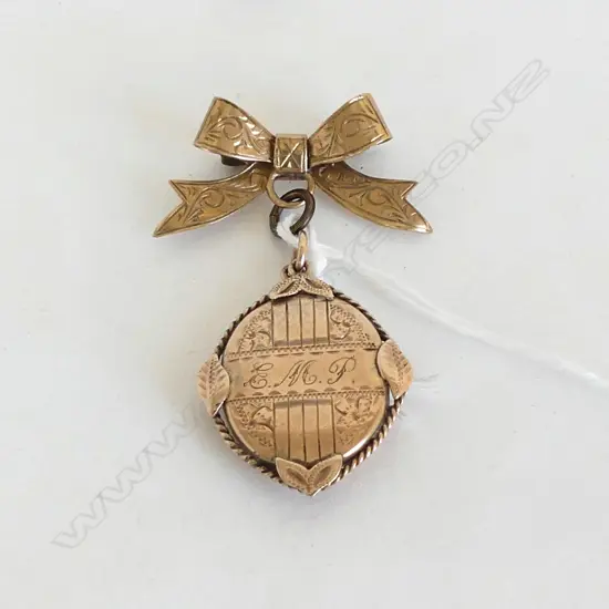 9CT BOW & LOCKET 7.2gms