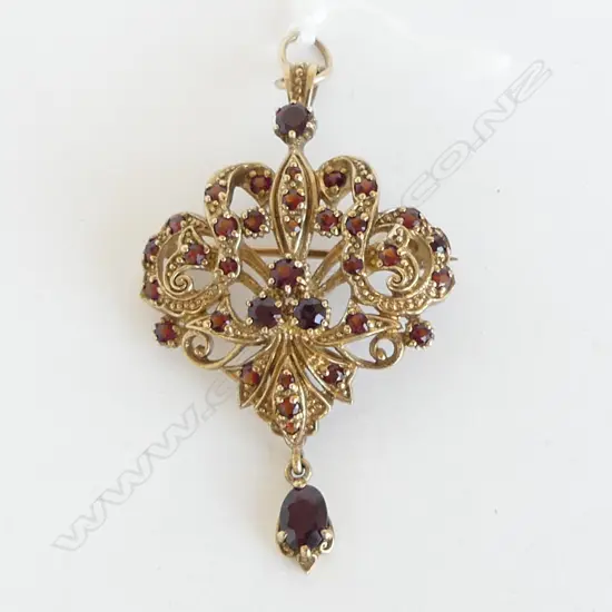9ct YELLOW GOLD & GARNET PENDANT BROOCH 10.3gms scrolling forms with pendant drop