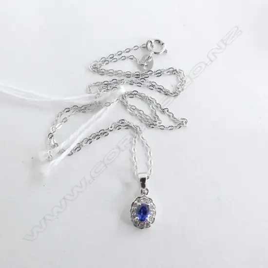 9ct WHITE GOLD DIAMOND & BLUE SAPPHIRE PENDENT on silver chain